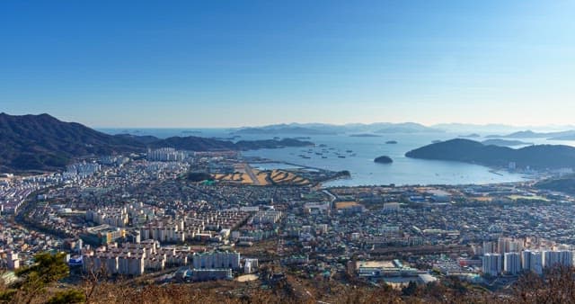 Day to night views of the city along the coastline