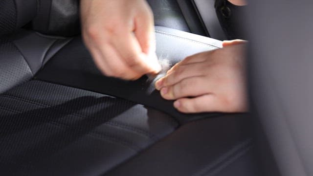 Rub sandpaper on car leather seats by hand