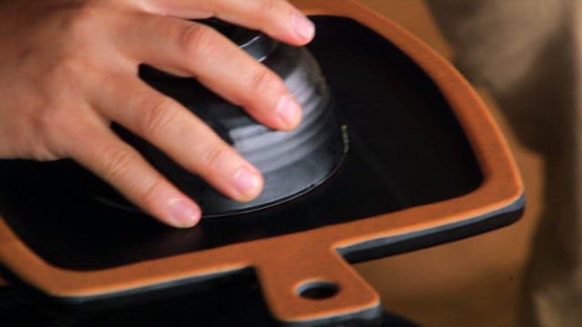 Hand shaping fried rice on a plate