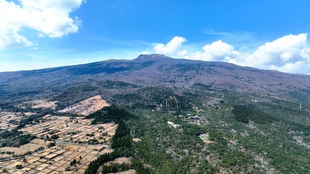 Vast mountain landscape with fields