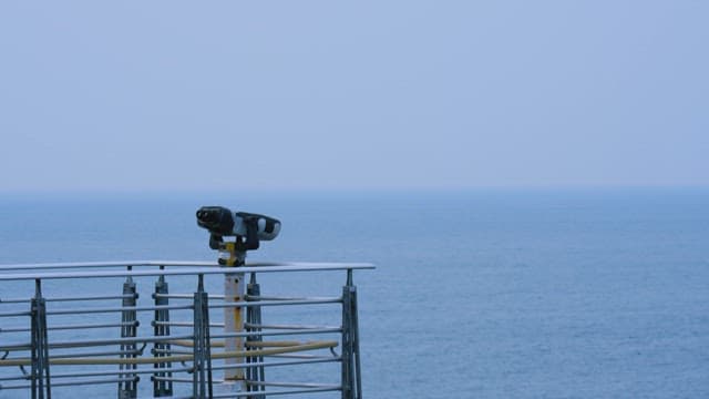 Man Approaches the Observatory Adjacent to the Sea