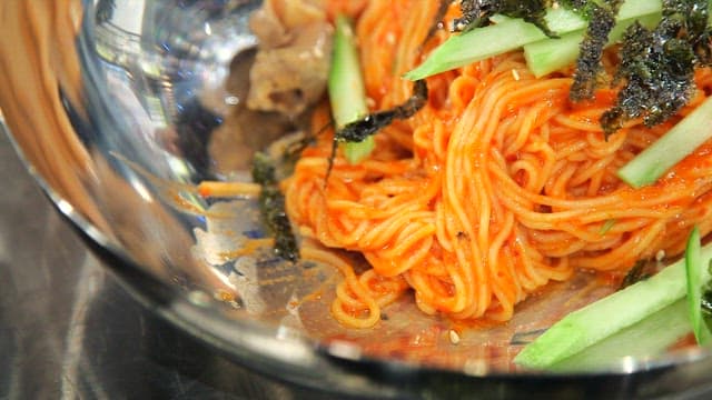 Spicy bibim noodles  with cucumber and seaweed