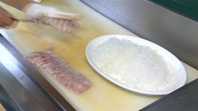 Arranging the Prepared Raw Fish Neatly on the Plate