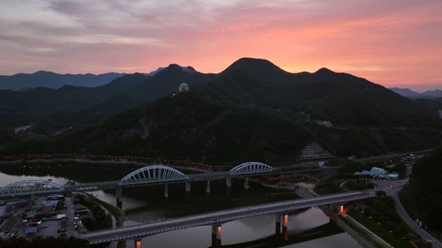 Sunset over mountains and bridges
