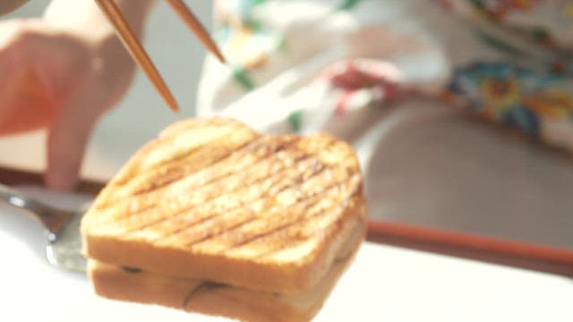 Golden-grilled sandwich placed on a cutting board