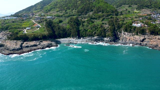 Coastal Village Overlooking the Sea Bordering a Cliff