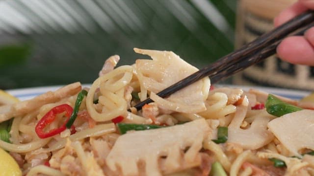 Chopsticks of stir-fried noodles with bamboo shoots