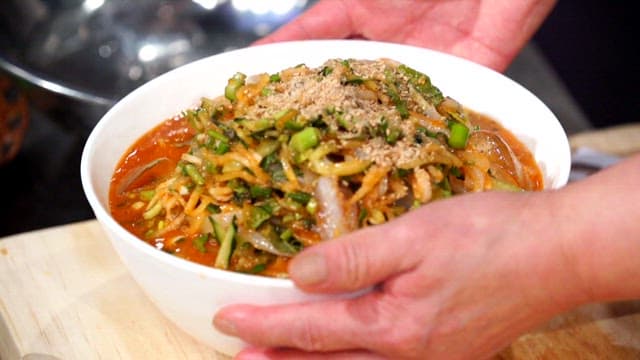 Fresh cold raw fish soup in a white bowl
