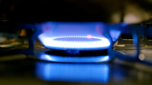 Blue flame on a gas stove burner