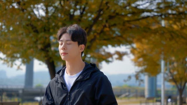 Man walking outdoors with earphones