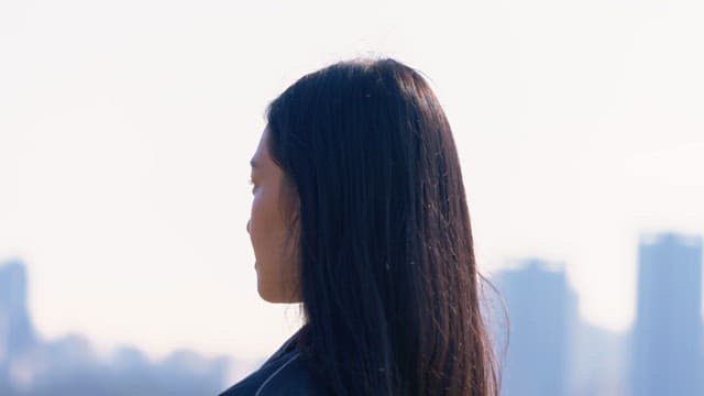 Woman tying her hair outdoors
