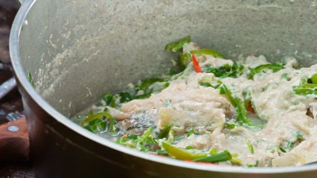 Fish curry cooked in a large pot