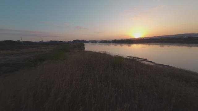 Sunset over a calm river landscape