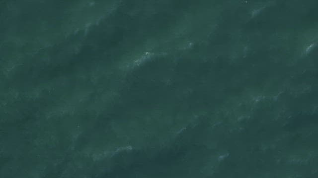 Waves gently moving on the water surface