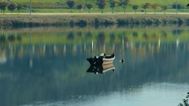 Traditional Ferry Boat Floating on a Calm Lake