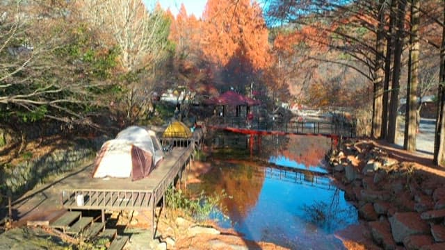 Camping site by the lakeside in Autumn