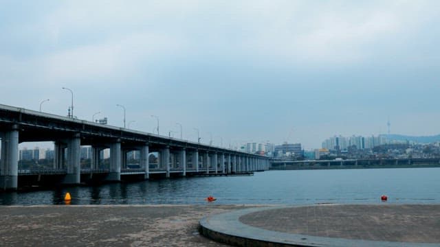 Overcast Sky Over Cityscape and Bridge