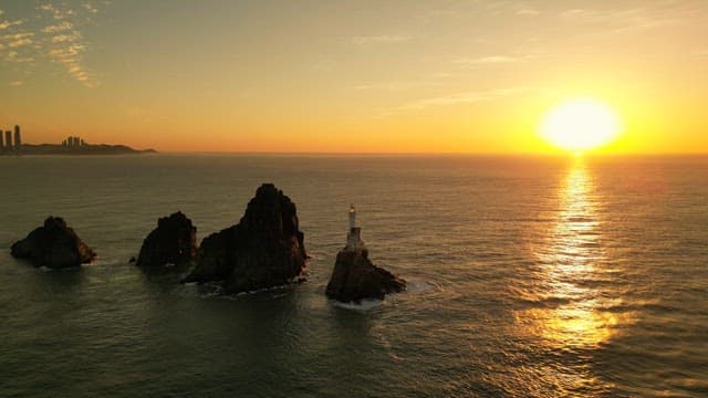 Sunset over the ocean with rocky islets