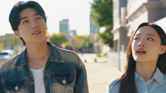 Couple walking down the street on a sunny day