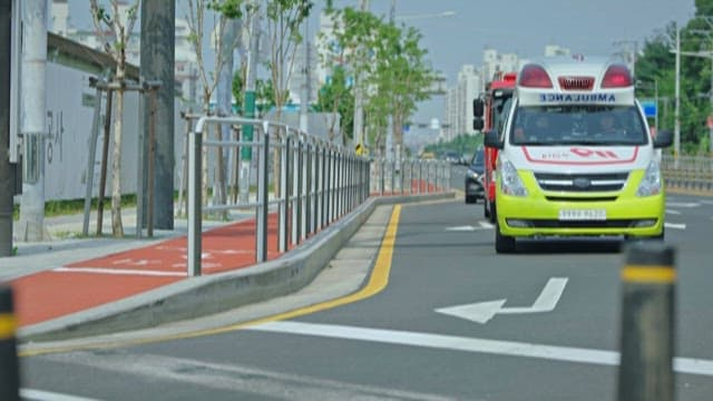 Ambulance and Fire Trucks Driving on City Roads