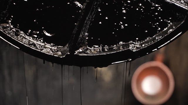 Black liquid dripping from metal parts