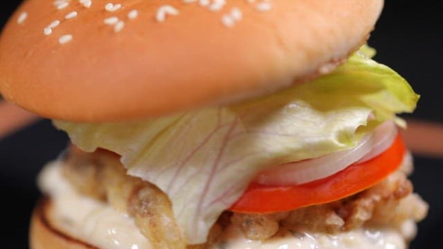 Hamburger with fried pork, tomato and garlic mayonnaise sauce