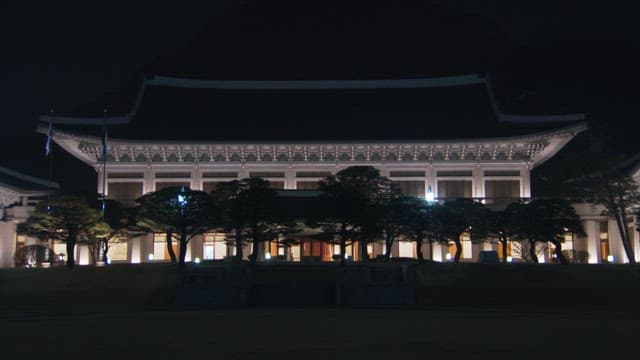 Illuminated Blue House at night