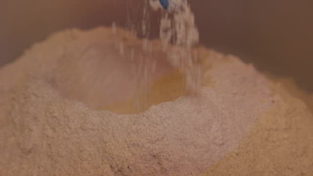 Flour Being Poured into a Bowl