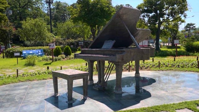 Outdoor Sculpture of Grand Piano in Park