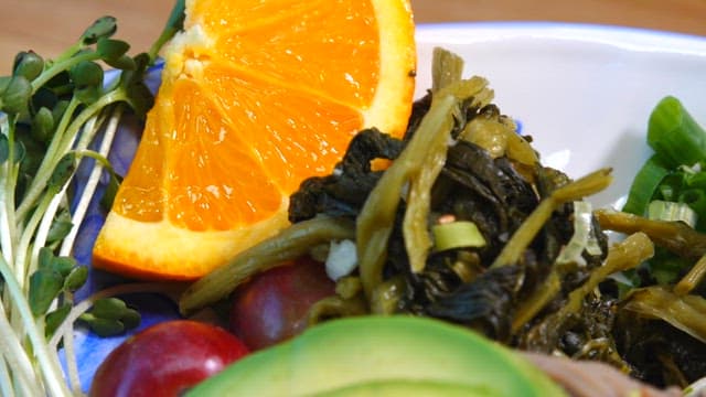 Buckwheat noodles plated with fresh vegetables and eggs
