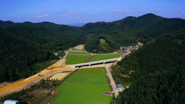 View of lush mountains with green agricultural fields