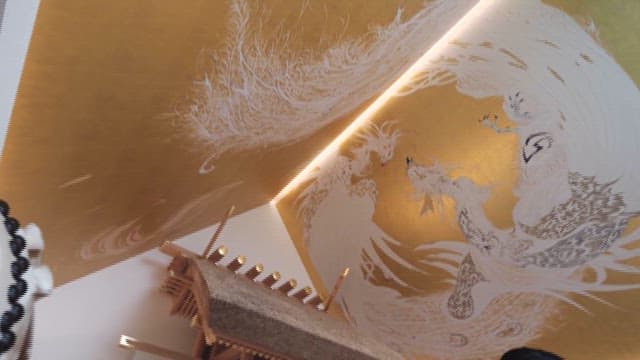 Golden Sculpture with a Dragon Engraved on It