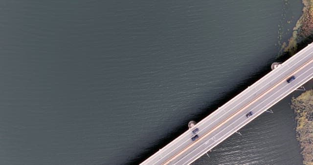 Cars driving on a bridge over water