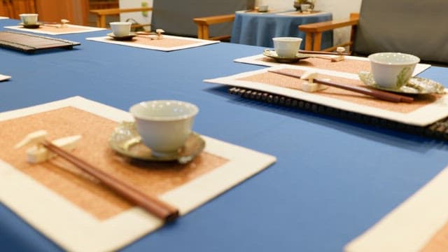 Elegant table with luxurious teacups and chopsticks