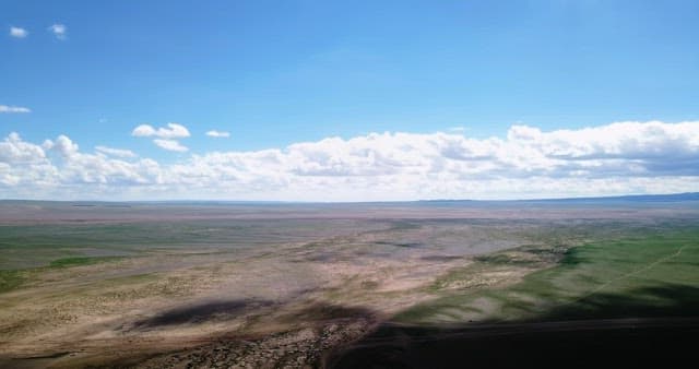 Vast landscape under a clear blue sky
