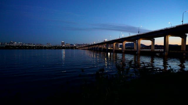 Nightscape Over the City and Reflective River