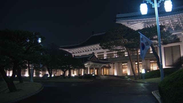 Illuminated Blue House at night