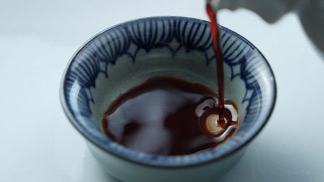 Surface of soy sauce poured into a small bowl