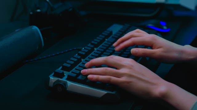 Person Typing on a Mechanical Keyboard