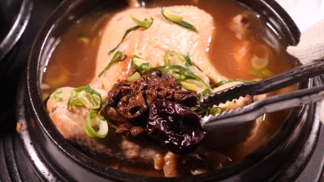 Steaming Bowl of Hearty Samgyetang with Medicinal Herbs