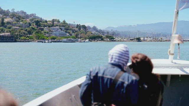 Passengers enjoying a ferry ride with scenic views
