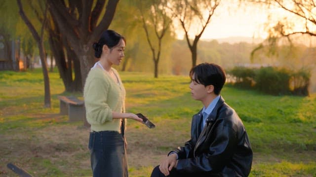 Couple arguing in a sunny park