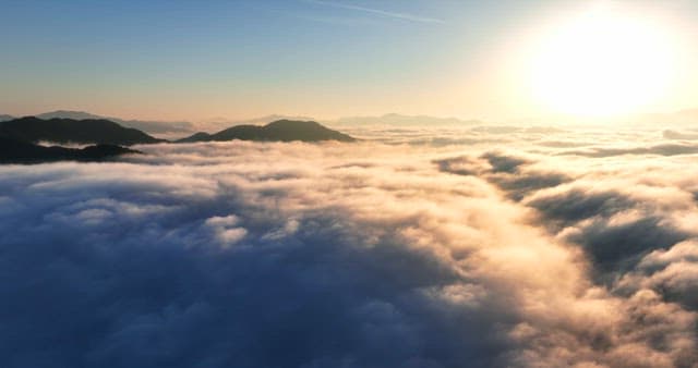 Sunrise over clouds and mountains