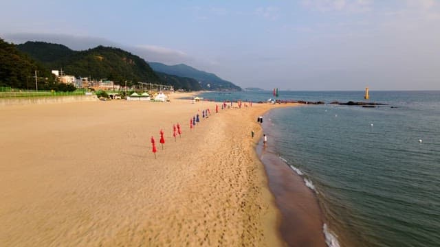Peaceful beach with colorful parasol