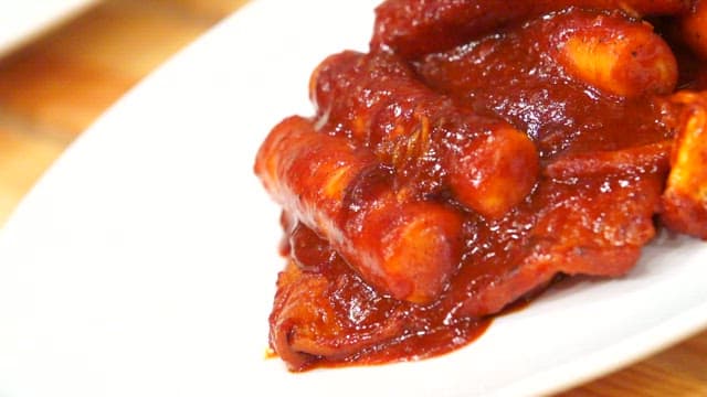Spicy tteokbokki on a white plate