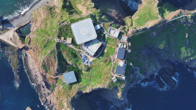 Beautiful island with solar panels and helipad