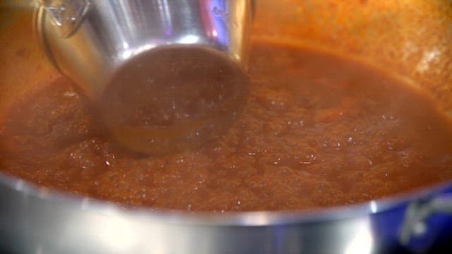 Spicy sauce simmering in a pot