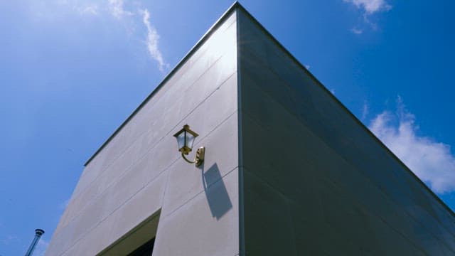 Modern building corner with blue sky