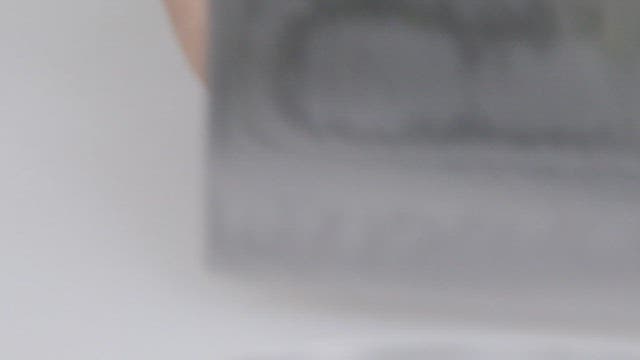 Cutting fresh conches on a cutting board with a knife