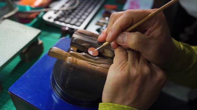 Craftsman Painting on Wooden Crafts